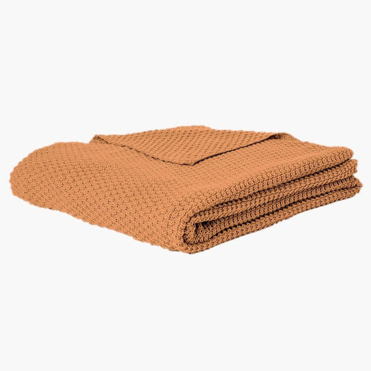 Jeté en tricot terracotta  CARAMELO ( 50" x 60'')- Par Brunelli Jeté  ,disponible chez Literie-Déco et moi 
